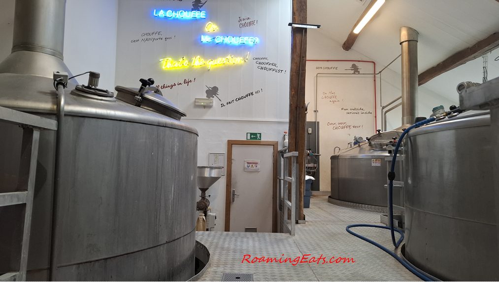 Stainless steel brewing vats inside the Chouffe brewhouse